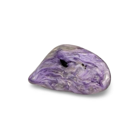 Purple charoite mineral on a white background